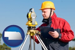 nebraska map icon and a surveyor with transit level equipment