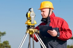 a surveyor with transit level equipment