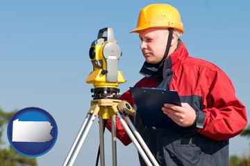 a surveyor with transit level equipment - with Pennsylvania icon