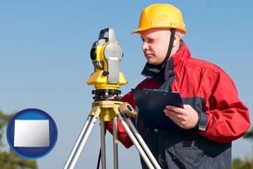 a surveyor with transit level equipment - with Wyoming icon